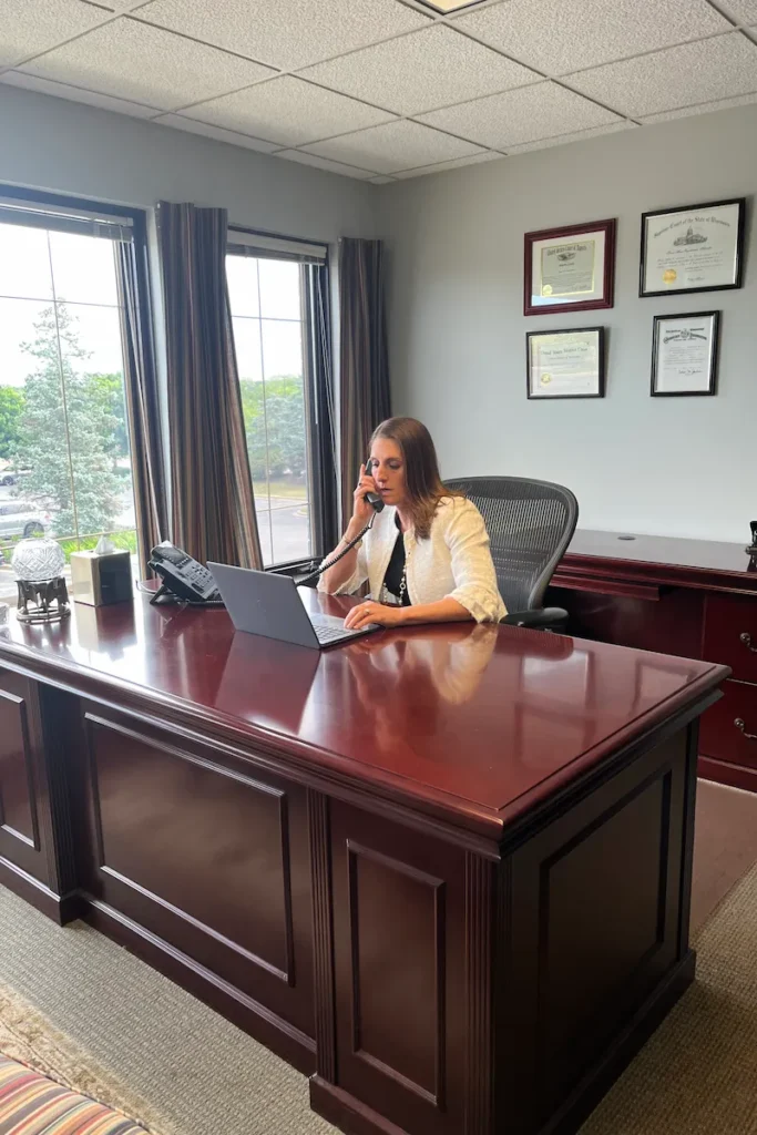 Susan on the phone at her desk